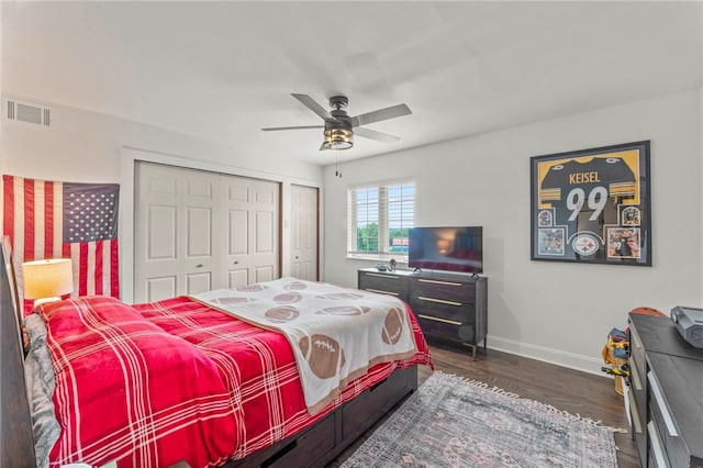 bedroom with a closet, ceiling fan, and dark hardwood / wood-style floors