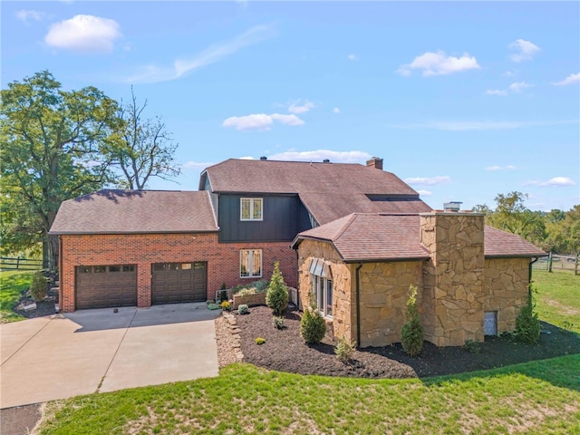 view of front of house featuring a garage and a front yard