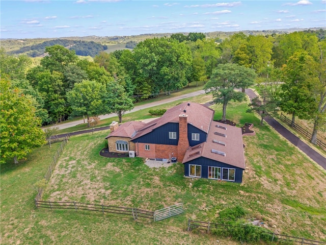 birds eye view of property with a rural view