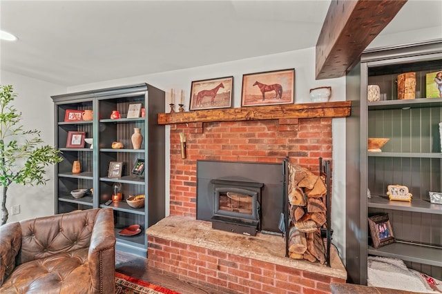 living room featuring a brick fireplace