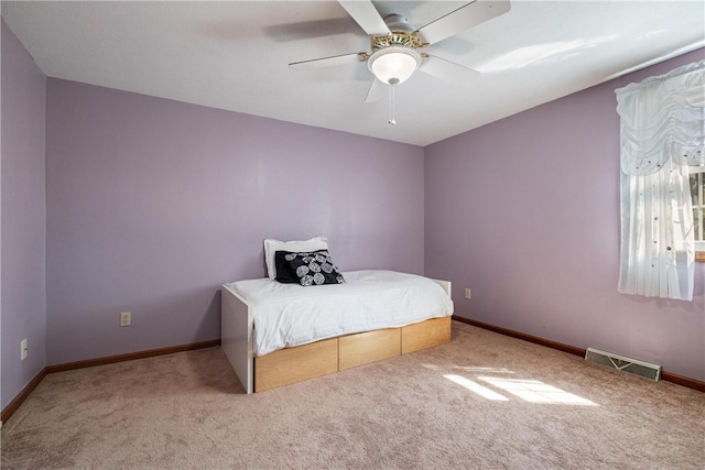 bedroom featuring ceiling fan and light colored carpet