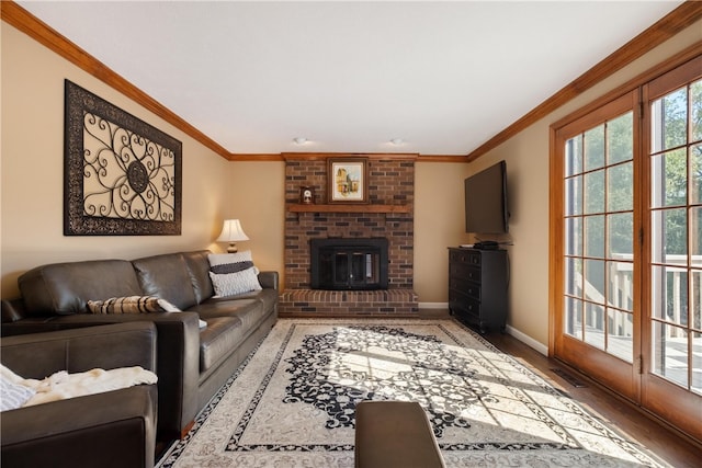 living room featuring hardwood / wood-style flooring, a fireplace, and crown molding