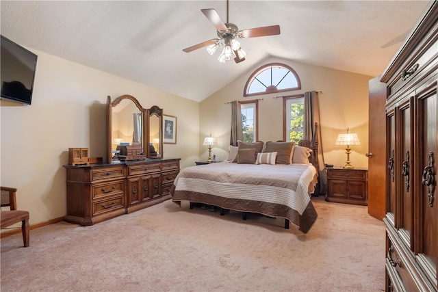 carpeted bedroom with lofted ceiling and ceiling fan