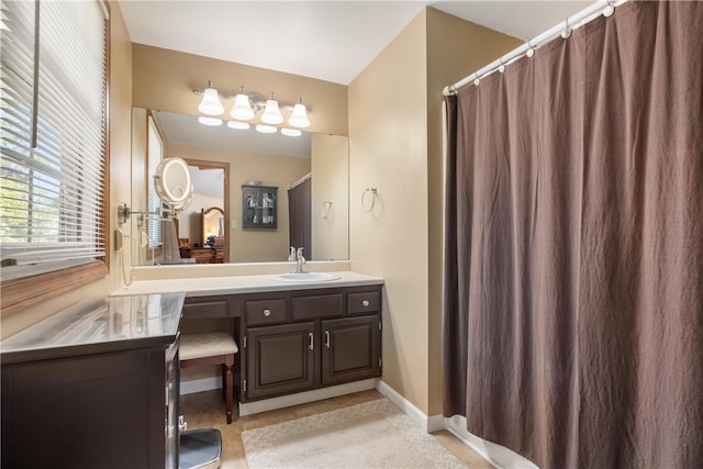 bathroom featuring vanity and walk in shower