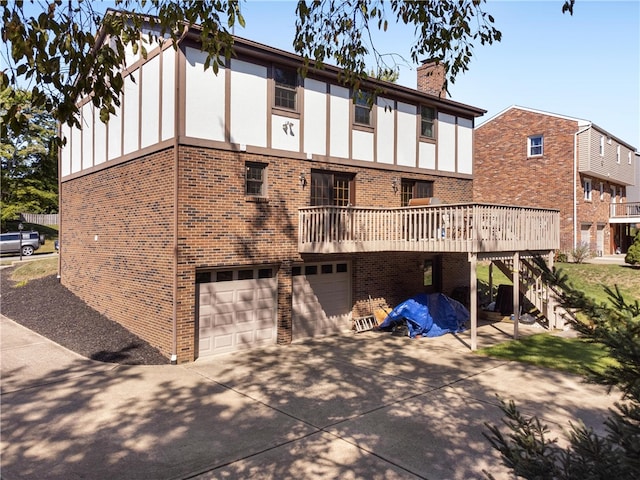 rear view of house featuring a garage