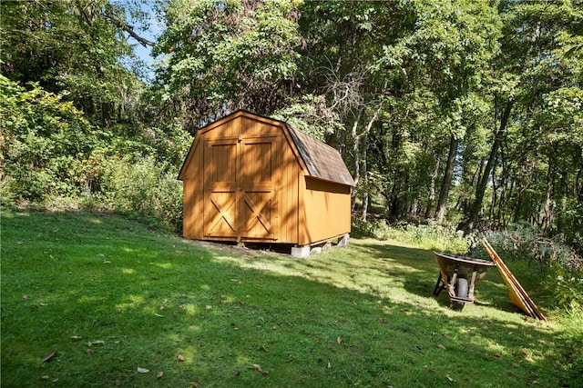 view of outbuilding with a lawn