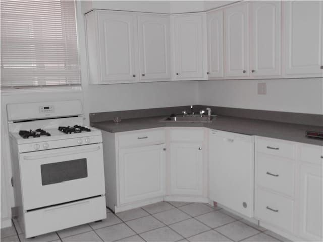 kitchen featuring white cabinetry, light tile patterned floors, white appliances, and sink