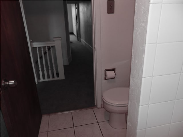 bathroom featuring tile patterned flooring and toilet