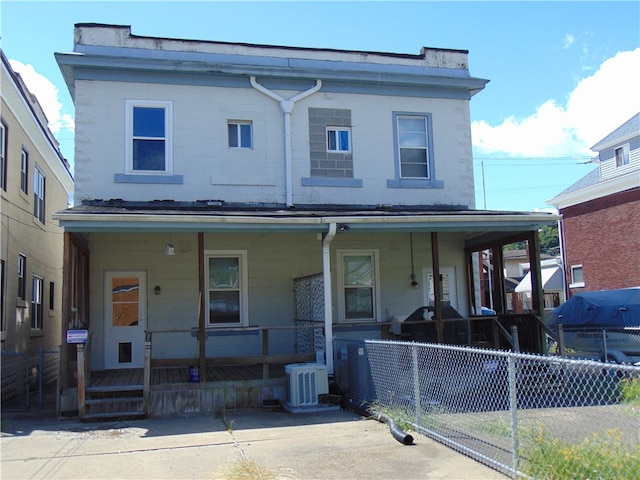 view of front of property with central air condition unit and a porch