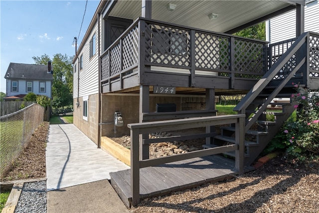 view of side of property featuring a deck