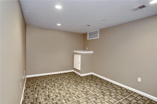 clothes washing area featuring carpet flooring