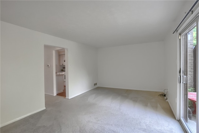 unfurnished room featuring carpet floors