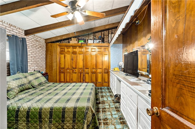 bedroom featuring lofted ceiling with beams, brick wall, and ceiling fan