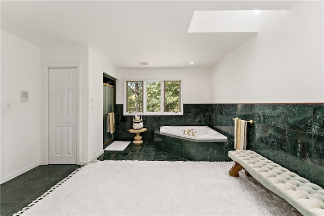 bathroom featuring tiled tub