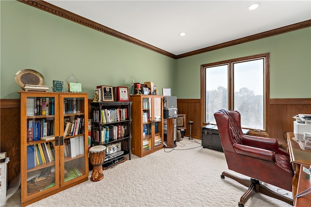 home office with crown molding, wood walls, and carpet floors