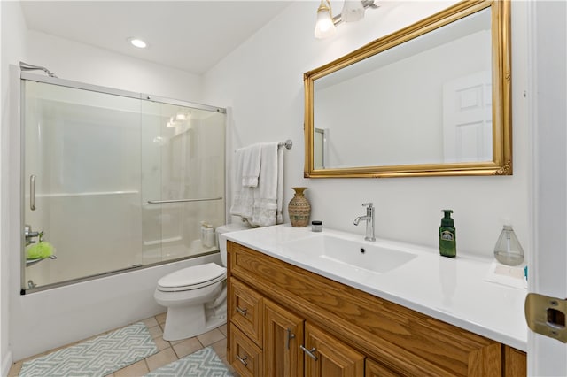 full bathroom with vanity, toilet, tile patterned floors, and enclosed tub / shower combo