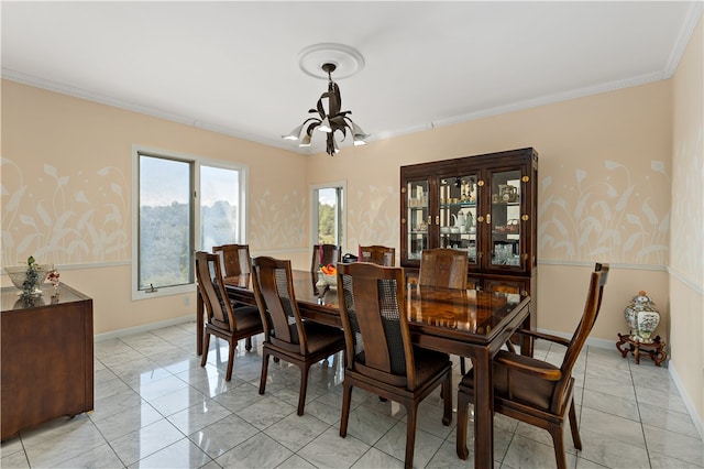 dining room with a chandelier and crown molding