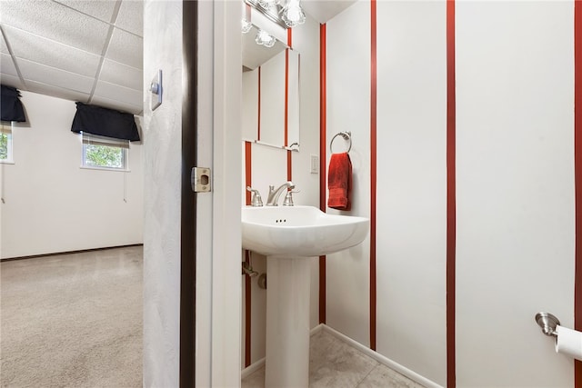 bathroom with a paneled ceiling