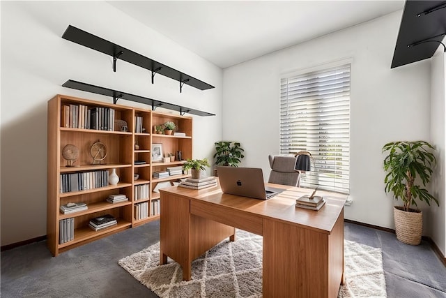 office space with dark colored carpet