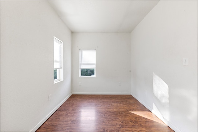 empty room featuring dark hardwood / wood-style floors