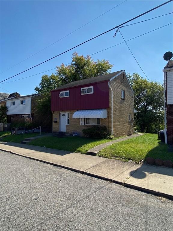 2608 Highland Ave, Mckeesport, PA 15132 - view of front of property featuring brick siding and a front lawn