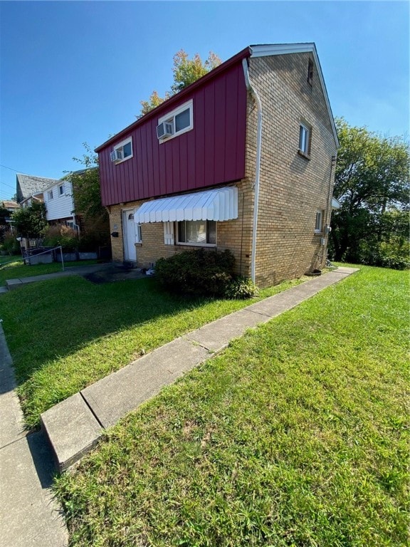 view of property exterior with a yard