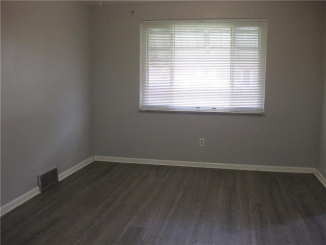 2608 Highland Ave, Mckeesport, PA 15132 - empty room with dark wood-style floors and baseboards