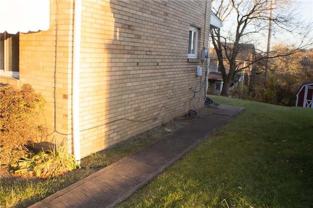 2608 Highland Ave, Mckeesport, PA 15132 - view of side of property with brick siding and a yard