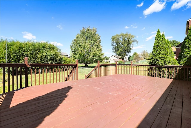 wooden terrace with a yard