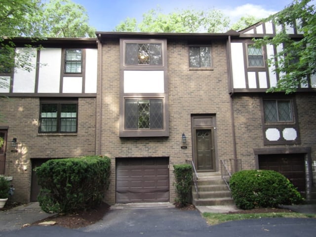 townhome / multi-family property featuring a garage