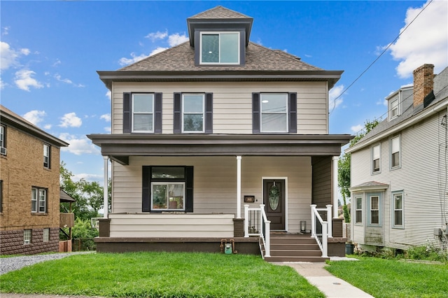 front of property featuring a front yard and a porch