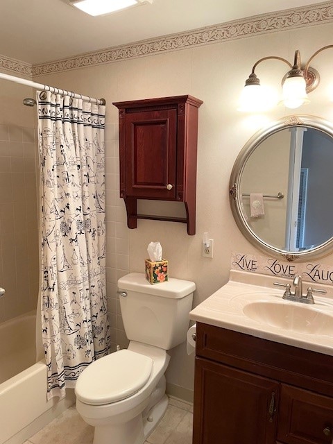 full bathroom with vanity, toilet, tile patterned floors, and shower / bath combo