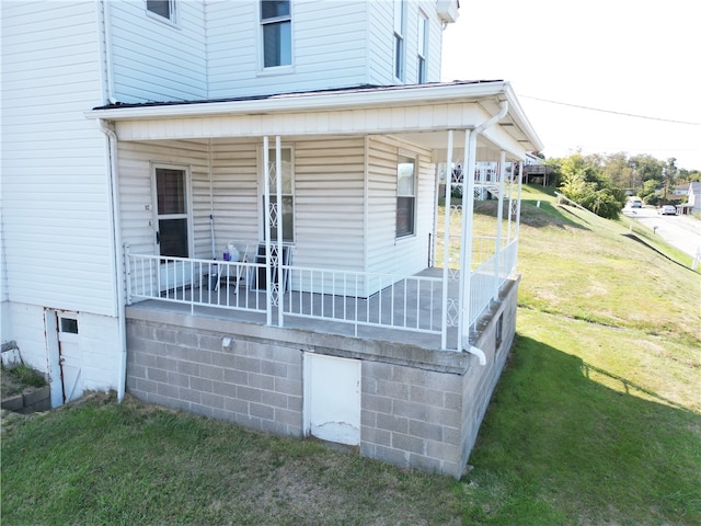 exterior space with a yard and a porch