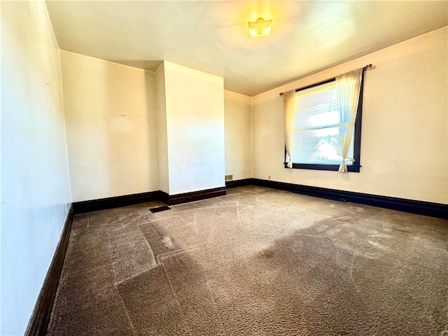 unfurnished room featuring carpet floors