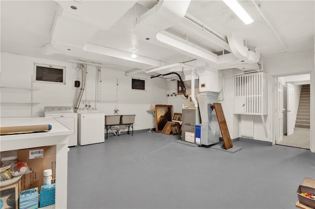 garage featuring sink and washer and dryer