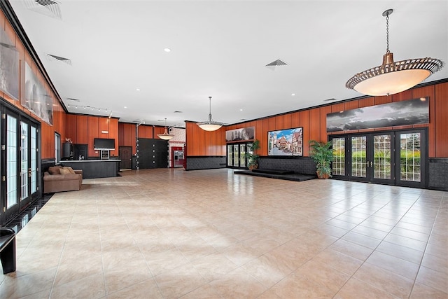 interior space with plenty of natural light and wood walls