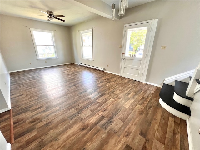 interior space featuring a baseboard heating unit, ceiling fan, and dark hardwood / wood-style flooring