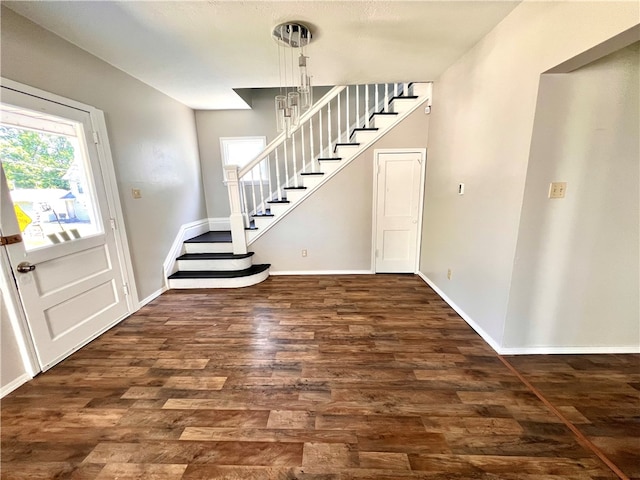 foyer entrance with dark hardwood / wood-style floors