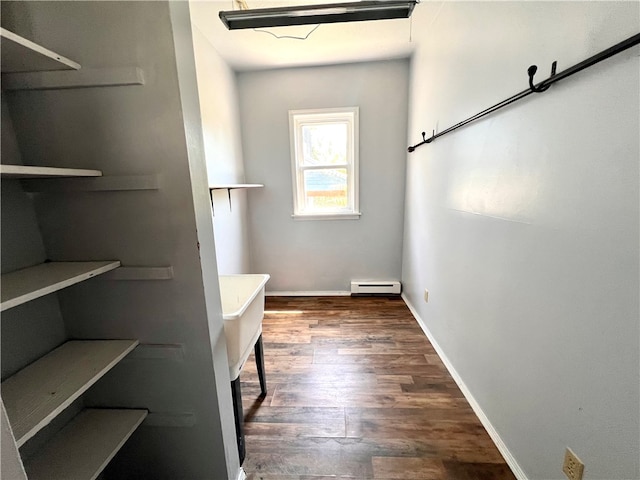 bathroom with a baseboard radiator and wood-type flooring