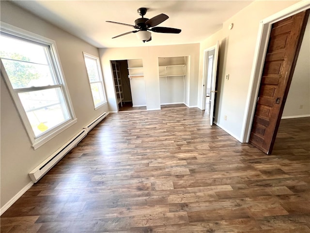 unfurnished bedroom featuring dark wood-type flooring, ceiling fan, and a baseboard radiator