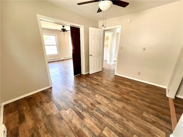 unfurnished bedroom with a closet, a baseboard radiator, dark hardwood / wood-style flooring, and ceiling fan