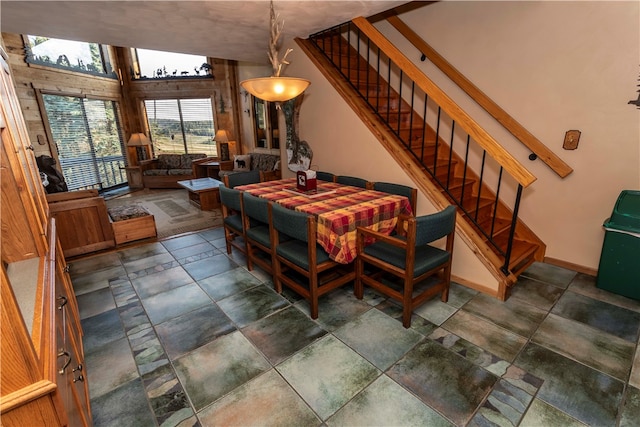 dining room featuring vaulted ceiling