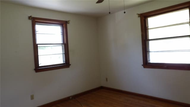 unfurnished room featuring wood-type flooring and ceiling fan