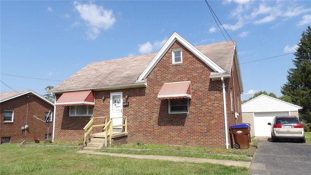 view of front facade with an outdoor structure, a garage, and a front lawn