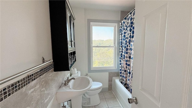 858 Monteiro St, Greenfield, PA 15217 - full bathroom featuring toilet, tile patterned floors, and shower / bath combo with shower curtain