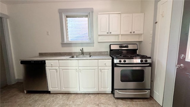 kitchen featuring white cabinets, stainless steel appliances, and a sink