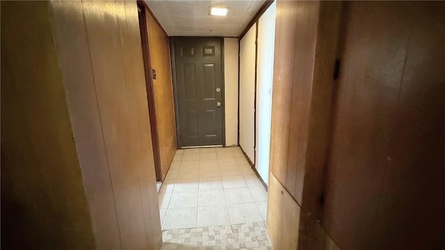 hallway featuring light tile patterned floors