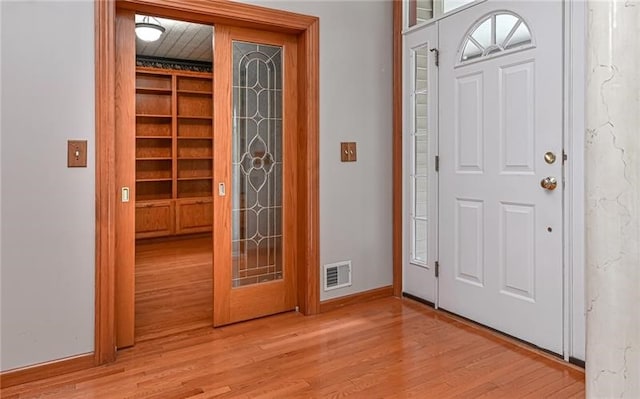 entrance foyer with light hardwood / wood-style floors