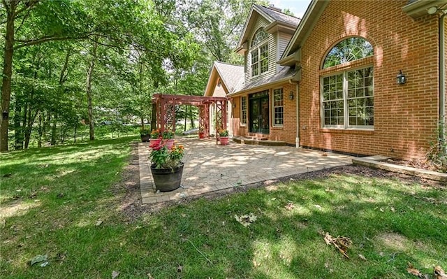 view of yard with a pergola and a patio area