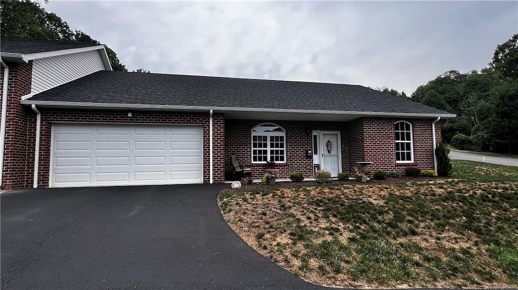 ranch-style home with a garage